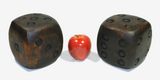 Pair Of Wood Carved Dice   Antique pair of wood carved dice. They are  quite heavy and solid. Original stained surface.   Note:  One dice has a crack. It does not go through.  The wear is consistent with the age and use.   This shows the vintage character of the dice.   Please see all photos for condition.