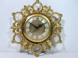 Vintage United Electric Wall Clock Vintage Electric Wall Clock Roman Numeral Numbers Convex Glass Floral Design Gold Metal Clock Signed Clock Face Plate United Clock Corp Brooklyn N.Y. Made In USA Art Deco Art Nouveau Wall Clock Antique 1950s 1960s Electric Wall Clock Kitchen Living Room Clock Vintage Clock Movie Prop 