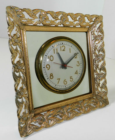 Vintage Gilbert Electric Table Clock Vintage Electric Tabletop Clock Minutes Numbers Second Sweep Hand Mirror Glass Frame Gold Metal Floral Design Clock Face Plate Signed Gilbert Made In USA Art Deco Art Nouveau Wall Clock Antique 1950s 1960s Electric Table Mantel Clock Living Room Home Office Clock Vintage Movie Prop 
