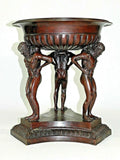 Jardiniere Bronze Planter Centerpiece Fruit Bowl  Large and heavy Jardiniere bronze planter, centerpiece, or fruit bowl. The design is 3 men holding up a large bowl on there back shoulders.  Measurements: 17 1/4” Tall 4” Deep Inside Bowl 15 1/4” Bowl Outside Diameter 10” Bowl Inside Bottom Diameter 15 1/2” Bottom Base Side To Side  Weight: 42 Pounds  -  10 Ounces Note: If you have any questions or concerns about the Jardiniere Bronze Planter Centerpiece, please contact us.