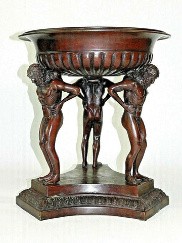 Jardiniere Bronze Planter Centerpiece Fruit Bowl  Large and heavy Jardiniere bronze planter, centerpiece, or fruit bowl. The design is 3 men holding up a large bowl on there back shoulders.  Measurements: 17 1/4” Tall 4” Deep Inside Bowl 15 1/4” Bowl Outside Diameter 10” Bowl Inside Bottom Diameter 15 1/2” Bottom Base Side To Side  Weight: 42 Pounds  -  10 Ounces Note: If you have any questions or concerns about the Jardiniere Bronze Planter Centerpiece, please contact us.